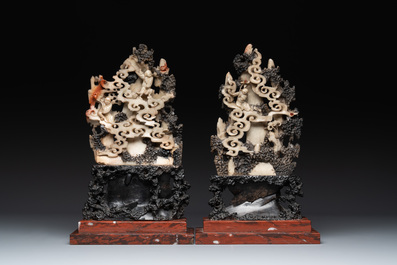 A pair of Chinese carved soapstone groups and a painted alabaster and wood table screen depicting a folk tale, 18/19th C.