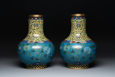 A pair of large Chinese cloisonn&eacute; 'magpies among flowering branches' vases, 19th C.