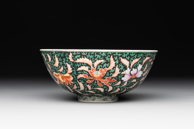 A Chinese black-ground famille rose 'flower scroll' bowl, Qianlong mark and of the period