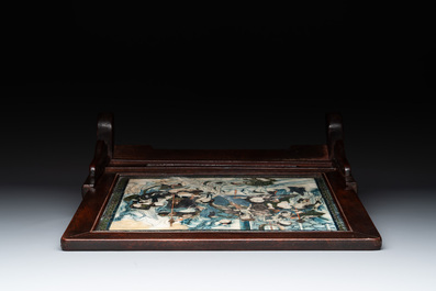 A pair of Chinese carved soapstone groups and a painted alabaster and wood table screen depicting a folk tale, 18/19th C.
