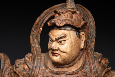 A large Chinese polychrome-lacquered wooden figure of a Guardian King, 18/19th C.