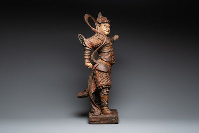 A large Chinese polychrome-lacquered wooden figure of a Guardian King, 18/19th C.