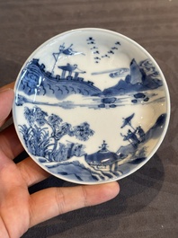 Four Chinese blue and white 'landscape' cups and saucers, Kangxi