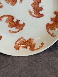 A Chinese iron-red 'bat' saucer and a black-glazed 'ship' saucer with calligraphy, Guangxu mark, 19th C.