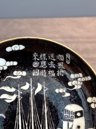 A Chinese iron-red 'bat' saucer and a black-glazed 'ship' saucer with calligraphy, Guangxu mark, 19th C.