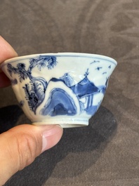 Four Chinese blue and white 'landscape' cups and saucers, Kangxi