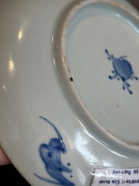 A Chinese iron-red 'bat' saucer and a black-glazed 'ship' saucer with calligraphy, Guangxu mark, 19th C.