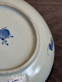 A Chinese iron-red 'bat' saucer and a black-glazed 'ship' saucer with calligraphy, Guangxu mark, 19th C.