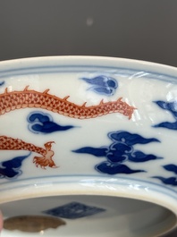 An imperial Chinese blue, white and iron-red 'dragon' plate, Qianlong mark and of the period