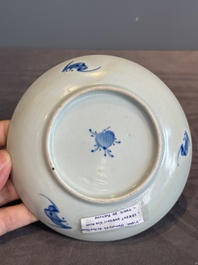 A Chinese iron-red 'bat' saucer and a black-glazed 'ship' saucer with calligraphy, Guangxu mark, 19th C.