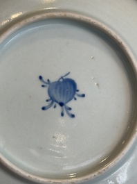 A Chinese iron-red 'bat' saucer and a black-glazed 'ship' saucer with calligraphy, Guangxu mark, 19th C.