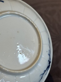 Four Chinese blue and white 'landscape' cups and saucers, Kangxi