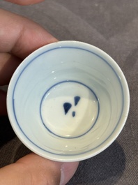 Seven Chinese blue, white and famille rose cups, six saucers and two English-decorated jarlets, Kangxi/Yongzheng