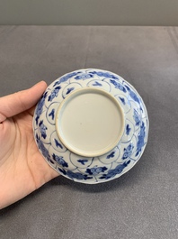 Twelve Chinese blue and white saucers and eight cups, Kangxi/Yongzheng