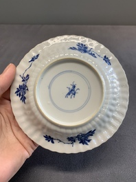 Twelve Chinese blue and white saucers and eight cups, Kangxi/Yongzheng