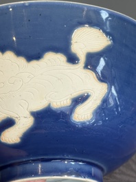 A Chinese powder blue-ground biscuit, blue and white 'Buddhist lion' bowl, Xuande mark, Kangxi
