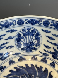 A Chinese powder blue-ground biscuit, blue and white 'Buddhist lion' bowl, Xuande mark, Kangxi