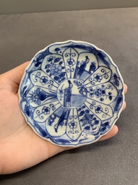Twelve Chinese blue and white saucers and eight cups, Kangxi/Yongzheng