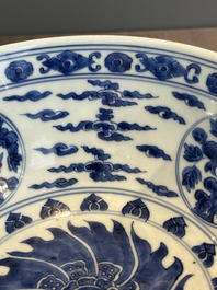 A Chinese powder blue-ground biscuit, blue and white 'Buddhist lion' bowl, Xuande mark, Kangxi