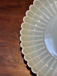 A Chinese celadon-glazed chrysanthemum-shaped plate, Qianlong mark, 20th C.