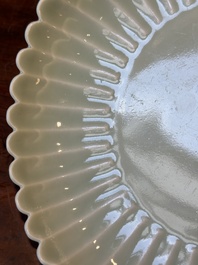 A Chinese celadon-glazed chrysanthemum-shaped plate, Qianlong mark, 20th C.