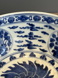 A Chinese powder blue-ground biscuit, blue and white 'Buddhist lion' bowl, Xuande mark, Kangxi