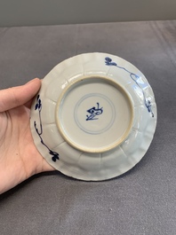Twelve Chinese blue and white saucers and eight cups, Kangxi/Yongzheng