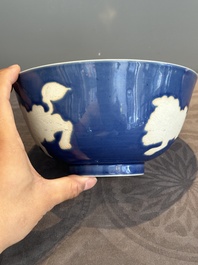 A Chinese powder blue-ground biscuit, blue and white 'Buddhist lion' bowl, Xuande mark, Kangxi
