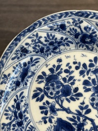 Five Chinese blue and white cups and saucers with floral design, Yu 玉 mark, Kangxi