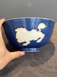 A Chinese powder blue-ground biscuit, blue and white 'Buddhist lion' bowl, Xuande mark, Kangxi