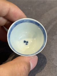 Seven Chinese blue, white and famille rose cups, six saucers and two English-decorated jarlets, Kangxi/Yongzheng