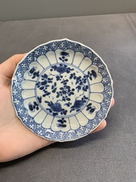 Twelve Chinese blue and white saucers and eight cups, Kangxi/Yongzheng