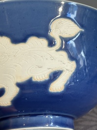 A Chinese powder blue-ground biscuit, blue and white 'Buddhist lion' bowl, Xuande mark, Kangxi