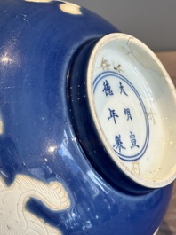 A Chinese powder blue-ground biscuit, blue and white 'Buddhist lion' bowl, Xuande mark, Kangxi