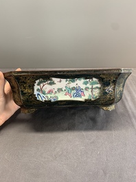 A Chinese Canton enamel gilt-decorated dark-green-ground jardini&egrave;re with four inserted plaques, Qianlong/Jiaqing