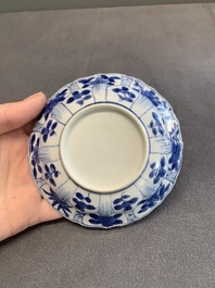 Twelve Chinese blue and white saucers and eight cups, Kangxi/Yongzheng