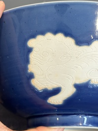 A Chinese powder blue-ground biscuit, blue and white 'Buddhist lion' bowl, Xuande mark, Kangxi