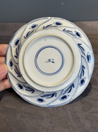 Five Chinese blue and white cups and saucers with floral design, Yu 玉 mark, Kangxi