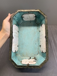 A Chinese Canton enamel gilt-decorated dark-green-ground jardini&egrave;re with four inserted plaques, Qianlong/Jiaqing