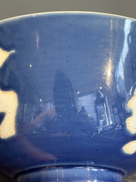 A Chinese powder blue-ground biscuit, blue and white 'Buddhist lion' bowl, Xuande mark, Kangxi