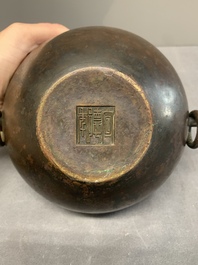 A Chinese bronze water pot with 'Taotie' handles, Xuande mark, 17/18th C.