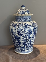 A Chinese blue and white vase and cover with landscapes and flowers, Kangxi