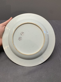 A Chinese famille rose 'lady and boy' plate, Yongzheng/Qianlong