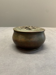 A rare Chinese bronze 'sage in a mountainous landscape' handwarmer, 17/18th C.