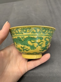 A pair of Chinese yellow-ground 'dragon' and 'shou' bowls, Guangxu mark and of the period