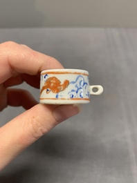 A collection of nine Chinese blue and white, monochrome and famille rose bird feeders, 19th C.
