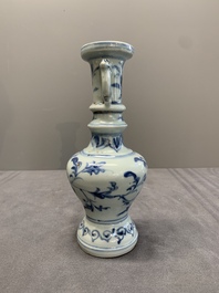A pair of Chinese blue and white handled vases with floral design, Ming