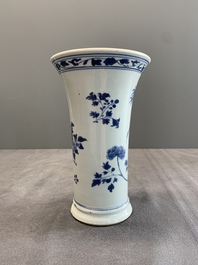 A pair of Chinese blue and white beaker vases with floral sprigs, Transitional period