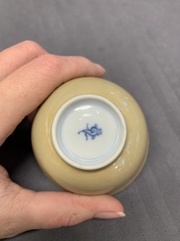 Five Chinese caf&eacute;-au-lait-ground blue and white cups and four saucers, conical shell mark, Kangxi