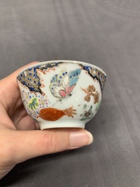 Three Chinese famille rose 'flowers and butterflies' cups and saucers, Yongzheng